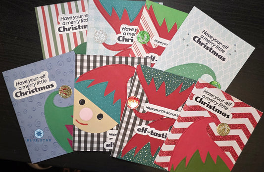 Collection of Christmas-themed greeting cards with elf designs