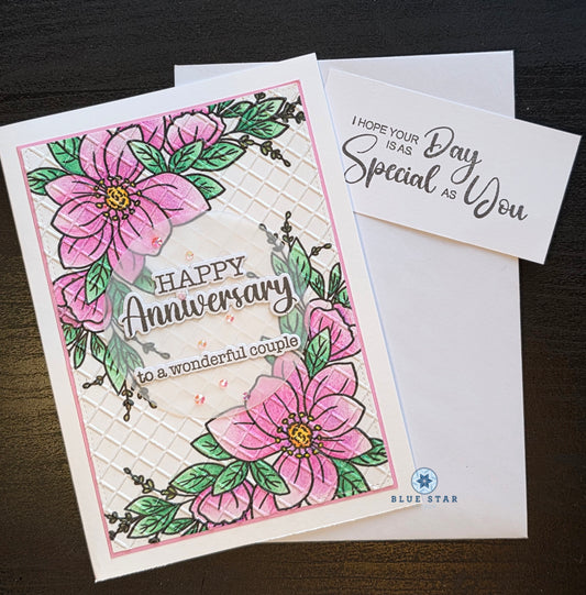 Anniversary card with pink flowers and green leaves on a white background