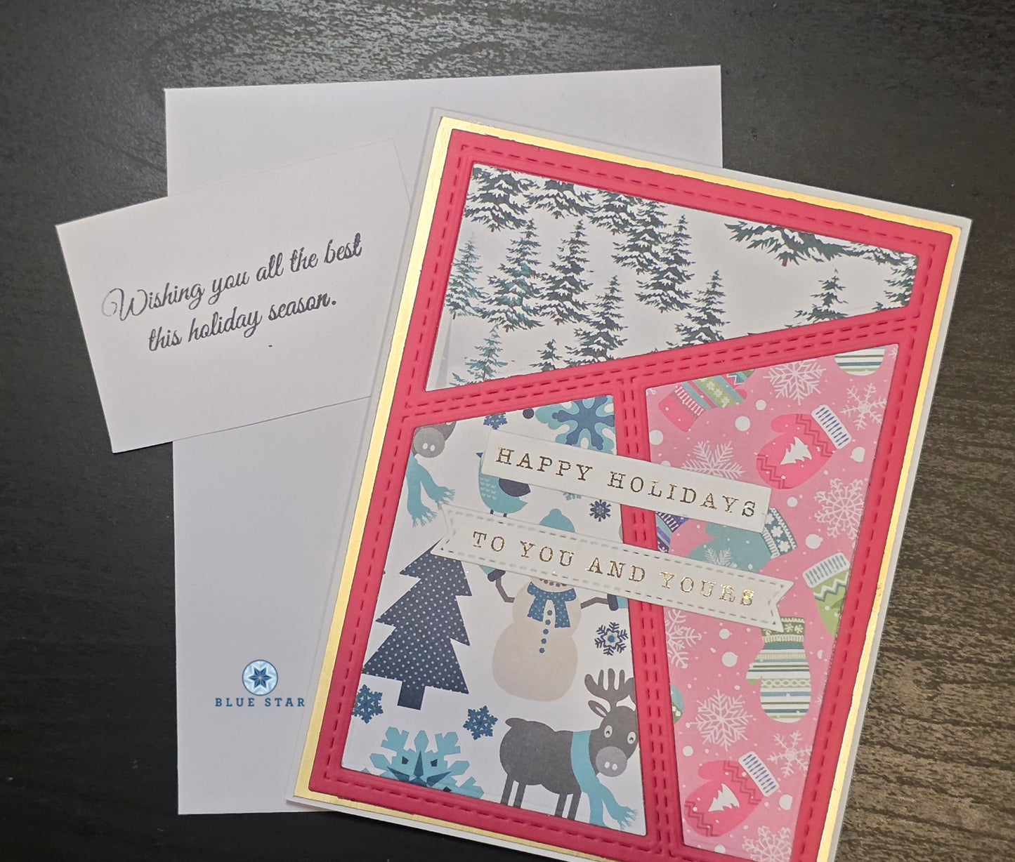 Holiday card with festive design and 'Happy Holidays' text, featuring a moose and winter elements.