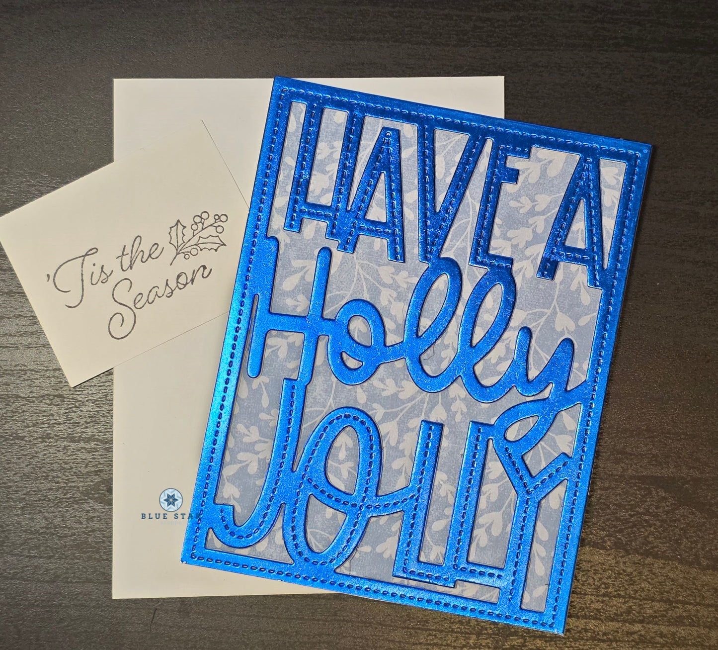 Blue decorative card with 'I have a Holly Jolly' text 