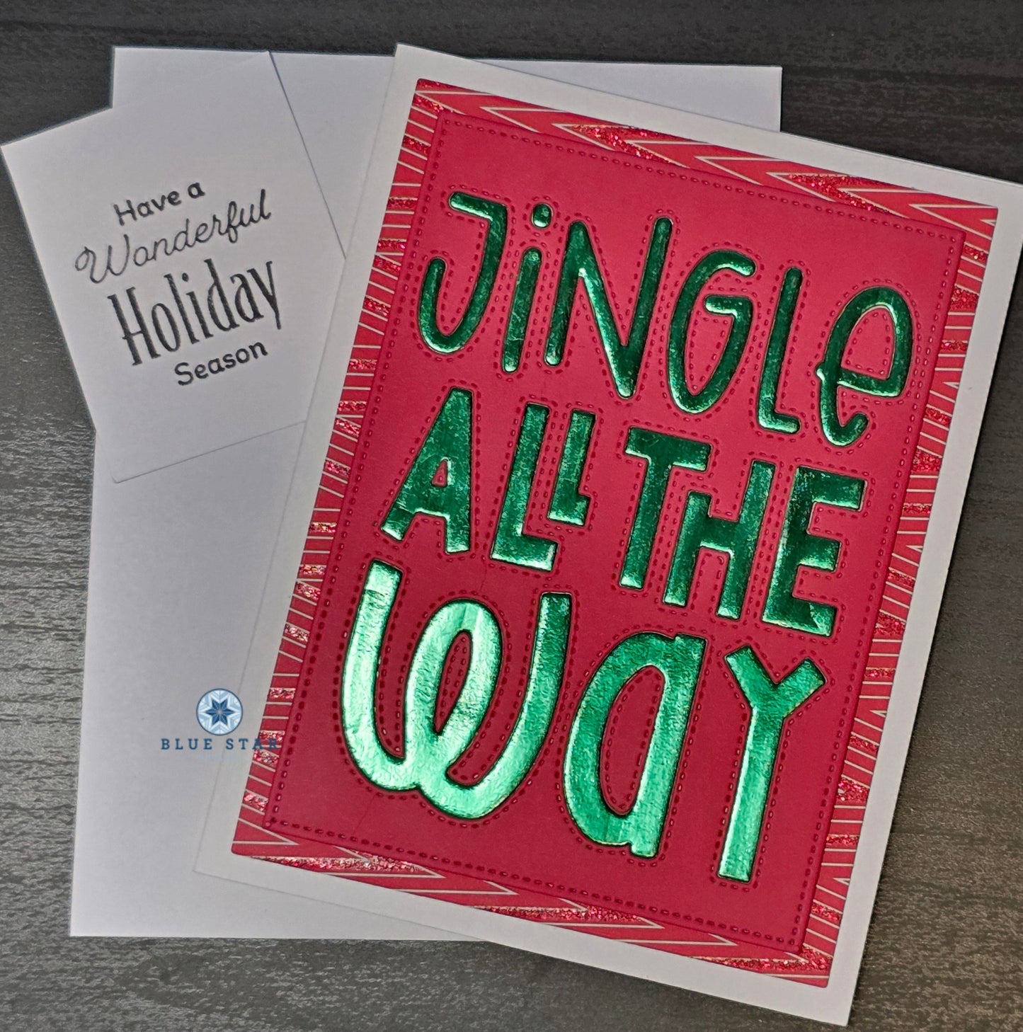 Red and green holiday card with 'Jingle All The Way' text