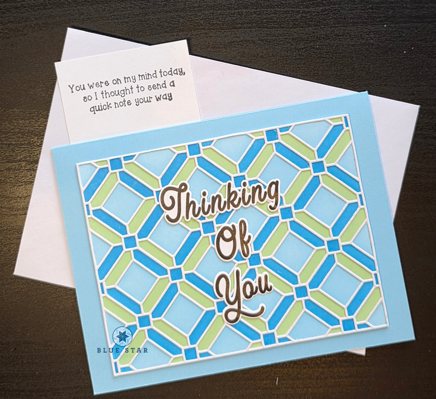Greeting card with geometric pattern and 'Thinking Of You' text 